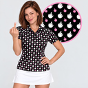 A woman modeling a short-sleeve collared shirt with a black background and an allover pattern of white hand silhouettes and small pink hearts. She is also wearing a white skirt, and a circular inset at the top right shows the shirt's print detail.